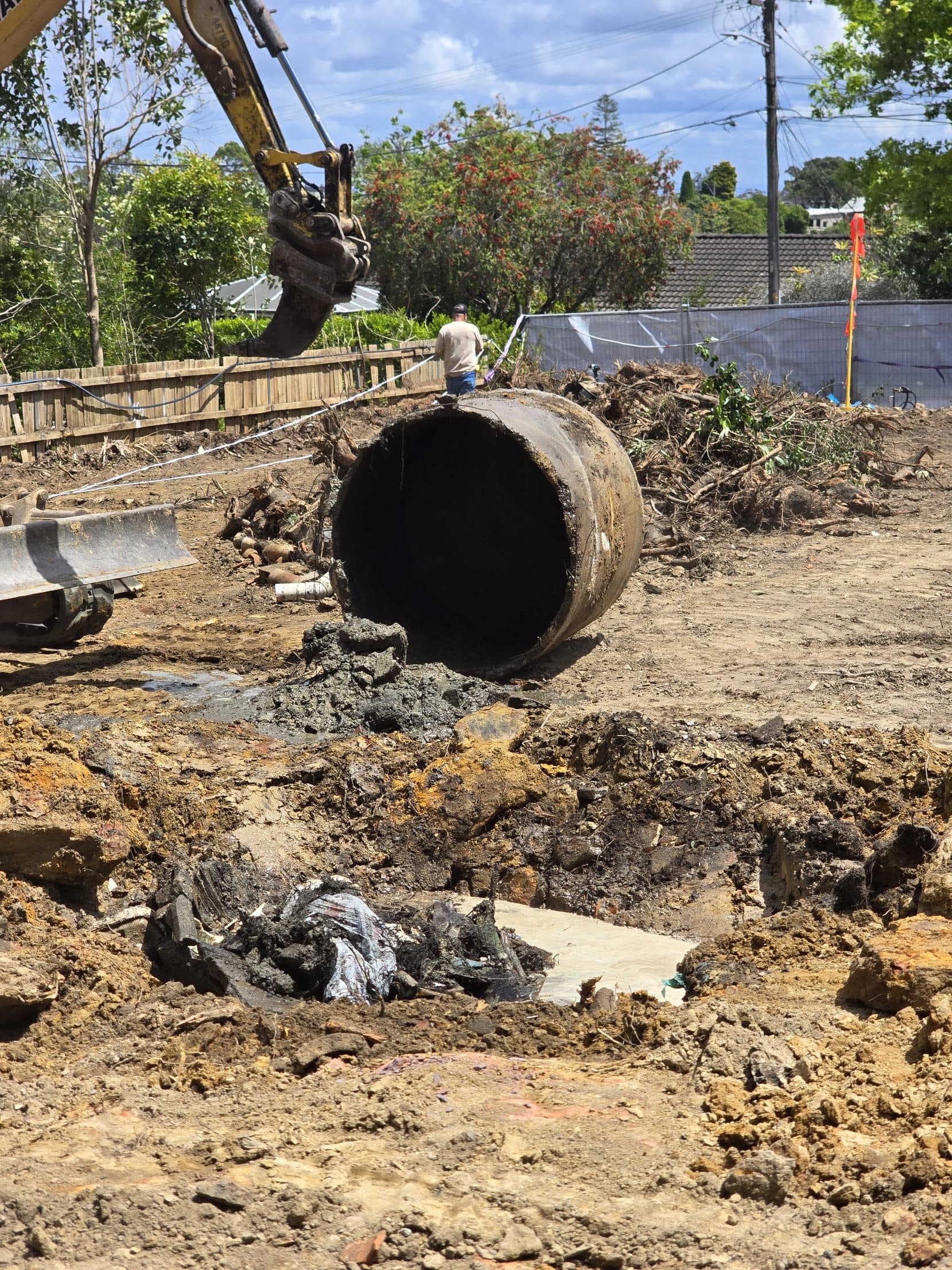 An old concrete septic tank lifted out of the ground during excavation